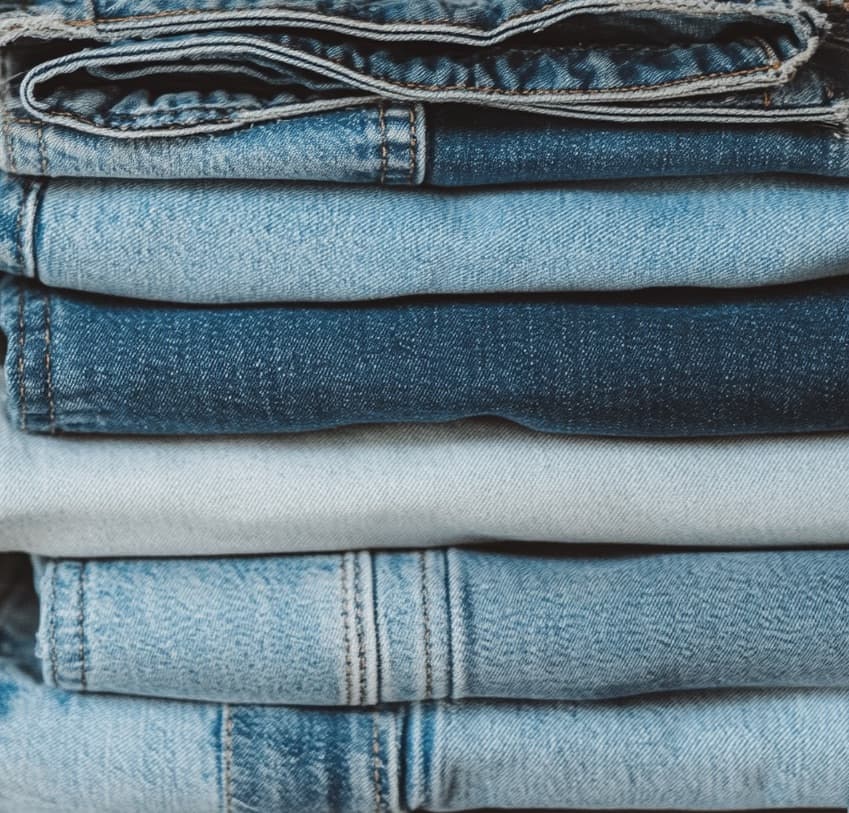 Stack of denim jeans